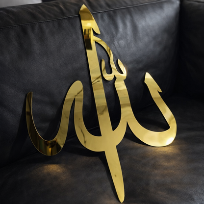 Gold decorative item on a black leather couch
