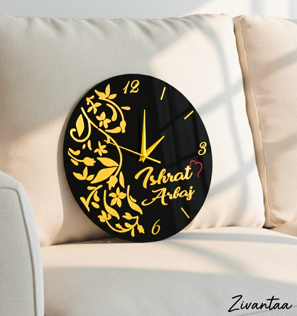 Decorative wall clock with floral design and personalized name on a beige couch