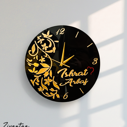 Decorative wall clock with floral design and personalized name on a light background
