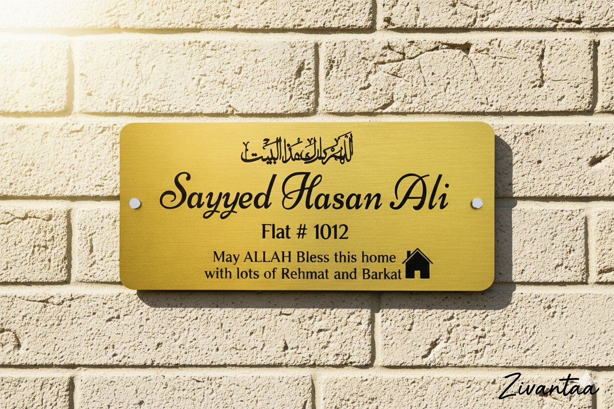 Gold nameplate with engraved text on a brick wall background
