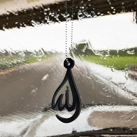 Black Arabic calligraphy car hanging ornament on a car window
