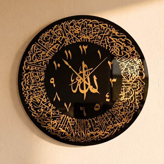Decorative wall clock with gold Arabic calligraphy on a black background