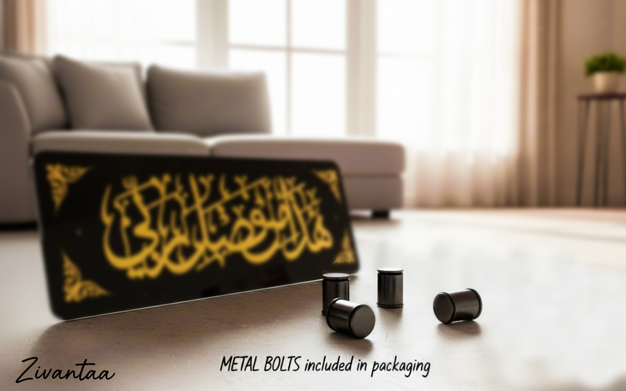 Black and yellow product with metal bolts on a light wooden floor, blurred sofa and window in the background.