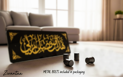 Black and yellow product with metal bolts on a light wooden floor, blurred sofa and window in the background.