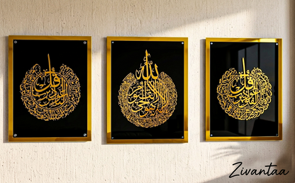 Three framed pieces of art with gold calligraphy on a black background, displayed on a wall.