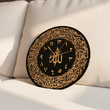 Decorative wall clock with Arabic calligraphy on a beige cushion