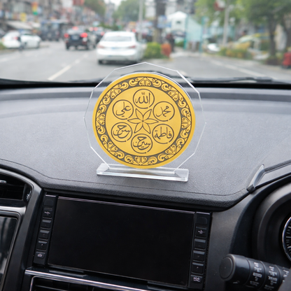 Decorative emblem on a car dashboard with a city street in the background